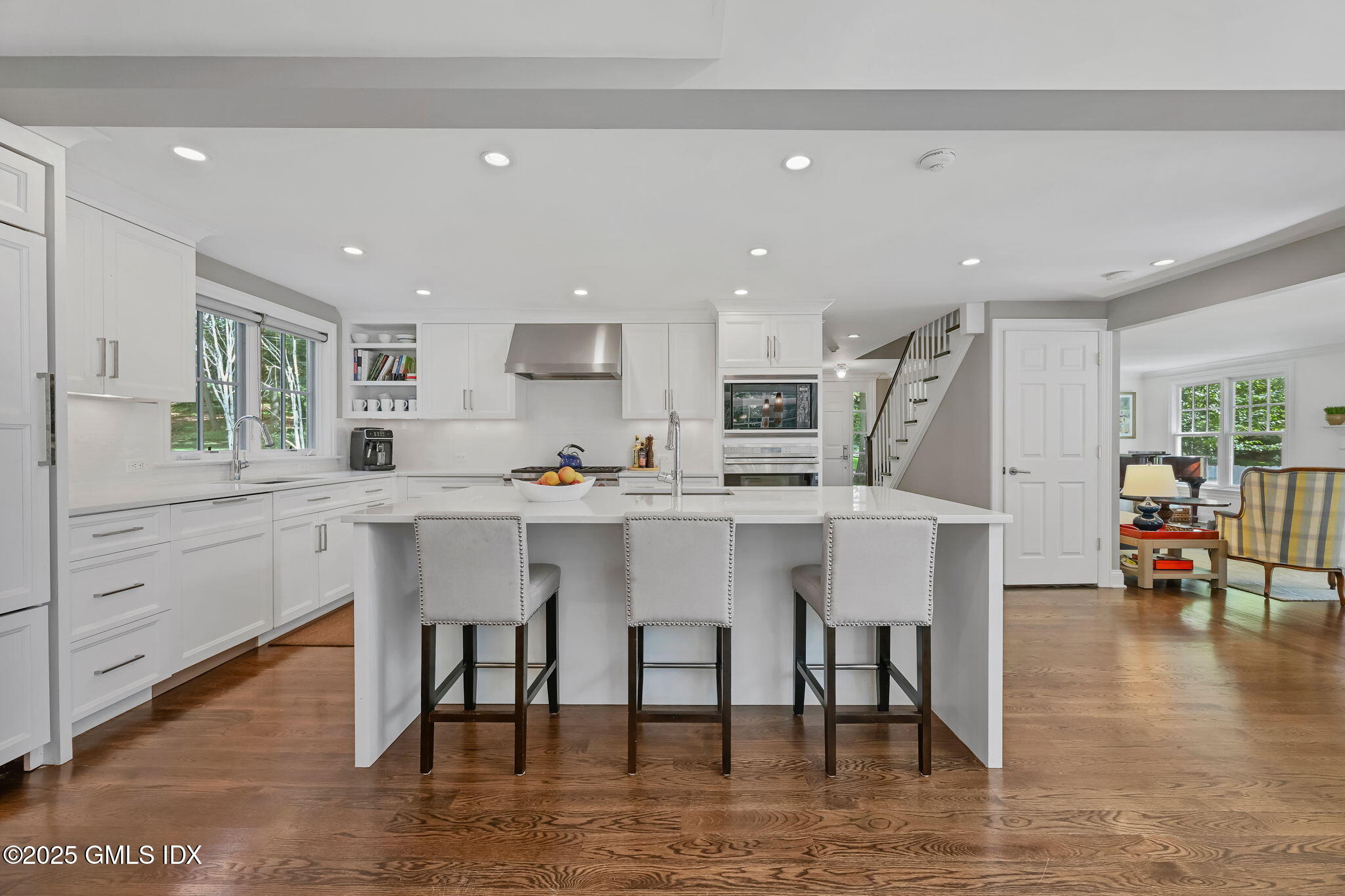 37 Ridgeview Avenue Greenwich, CT 06830 - Photo 26 of 49 a kitchen with stainless steel appliances kitchen island granite countertop a table chairs sink and cabinets