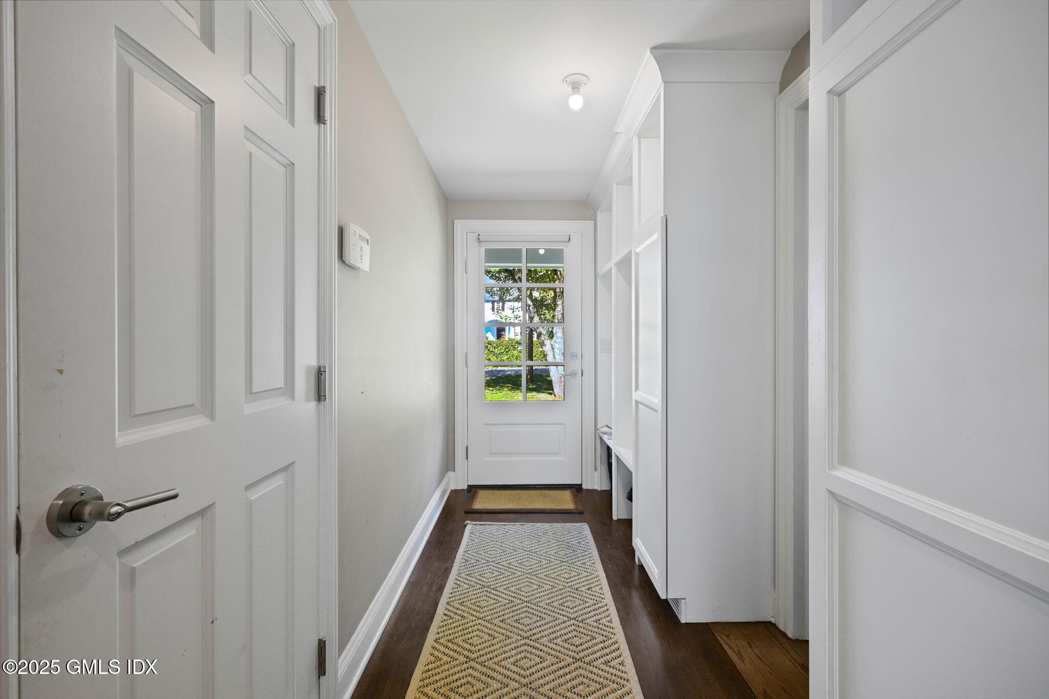 37 Ridgeview Avenue Greenwich, CT 06830 - Photo 28 of 49 a view of a hallway with wooden floor and closet