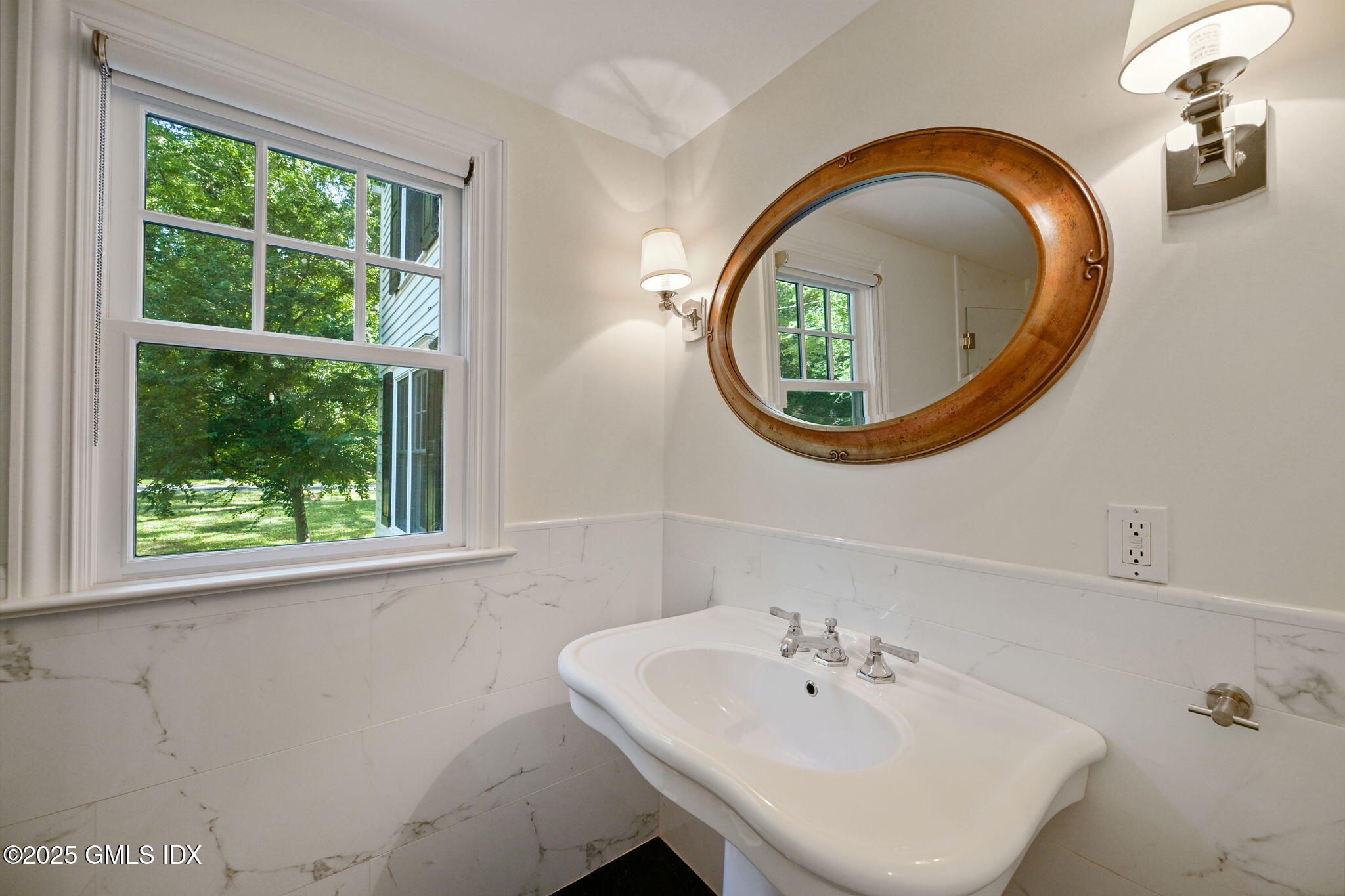 37 Ridgeview Avenue Greenwich, CT 06830 - Photo 29 of 49 a bathroom with a sink and a mirror
