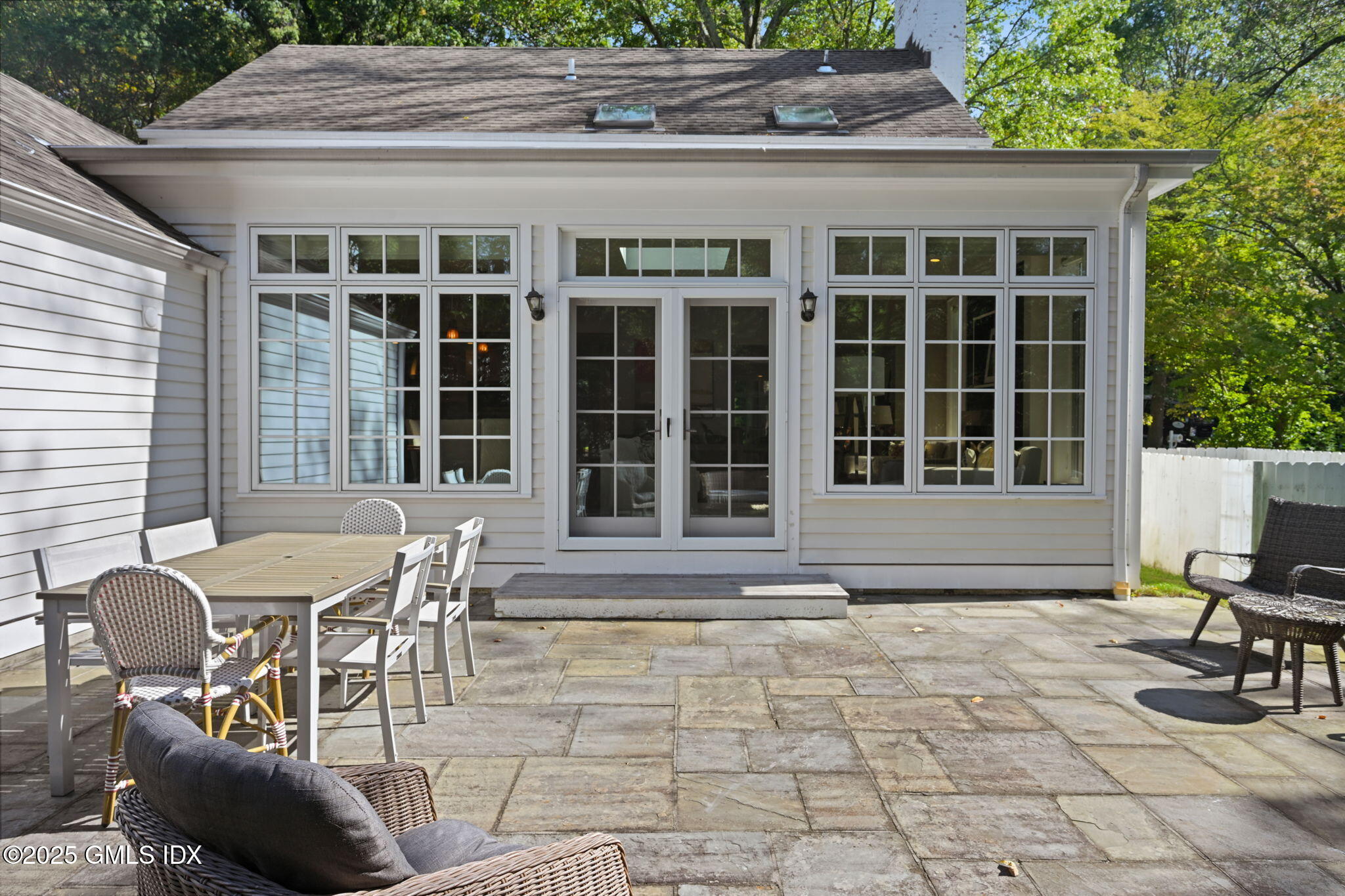 37 Ridgeview Avenue Greenwich, CT 06830 - Photo 40 of 49 a view of a patio with table and chairs with wooden floor and fence