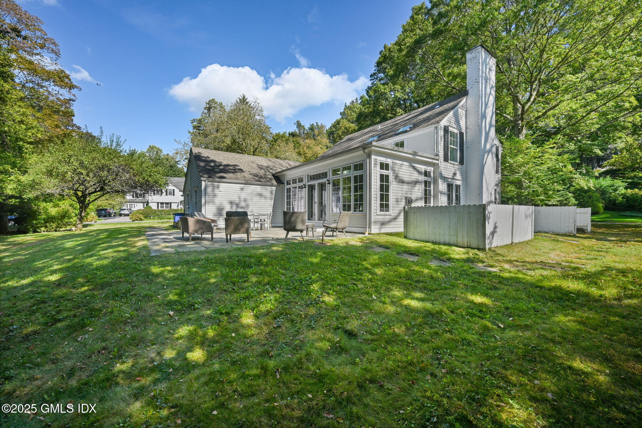 37 Ridgeview Avenue Greenwich, CT 06830 - Photo 42 of 49 a view of a house with a big yard potted plants and large tree