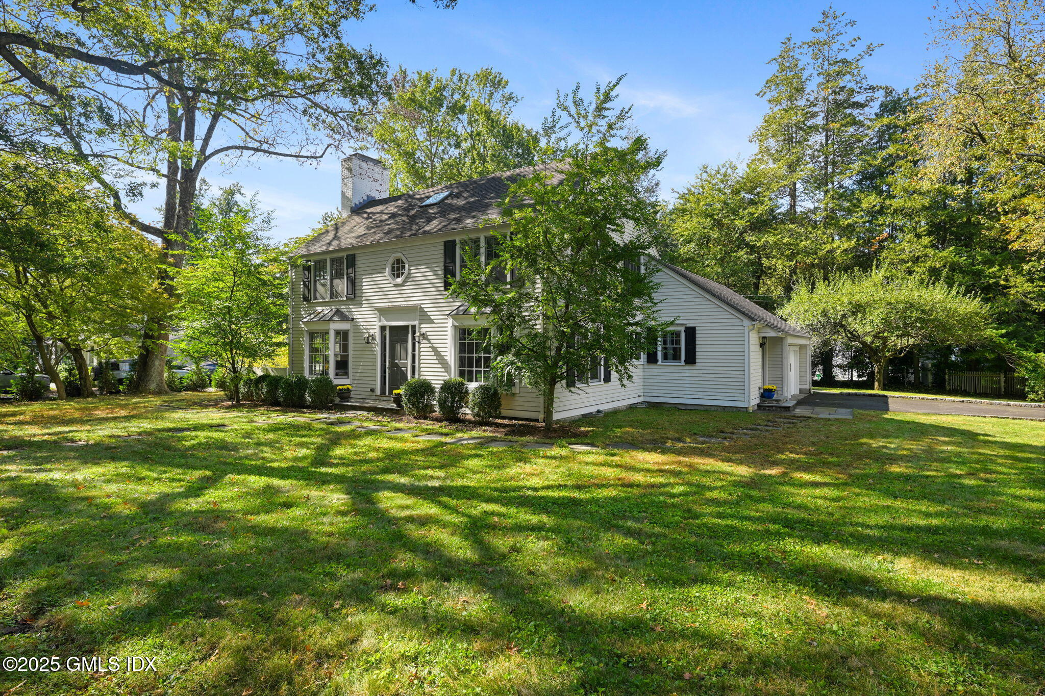 37 Ridgeview Avenue Greenwich, CT 06830 - Photo 48 of 49 a white house that has a big yard with trees