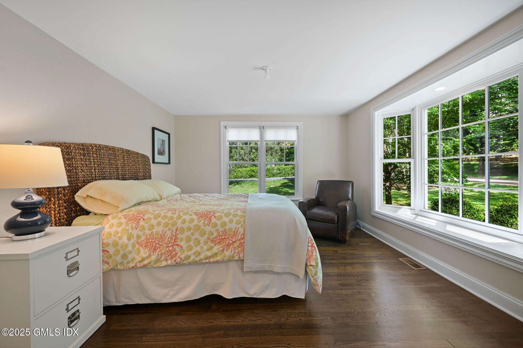 37 Ridgeview Avenue Greenwich, CT 06830 - Photo 5 of 49 a bedroom with a bed and wooden floor