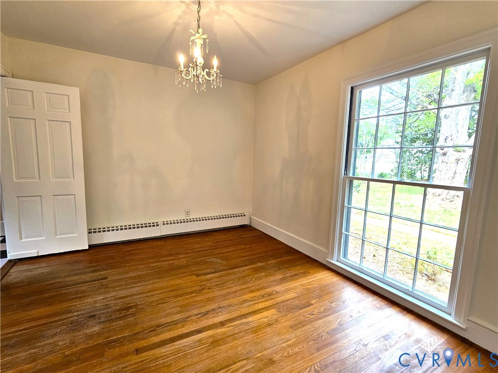 3271 Rosney Road Dillwyn, VA 23936 - Photo 12 of 45 a view of an empty room with wooden floor and a window