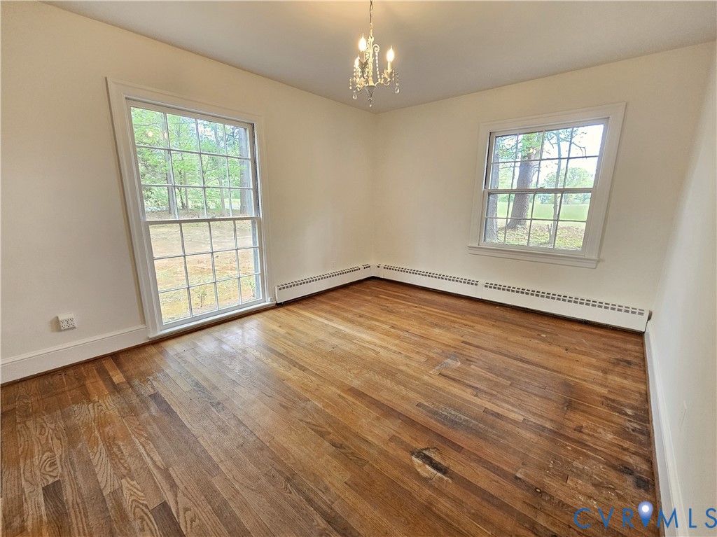 3271 Rosney Road Dillwyn, VA 23936 - Photo 20 of 45 a view of an empty room with wooden floor and a window