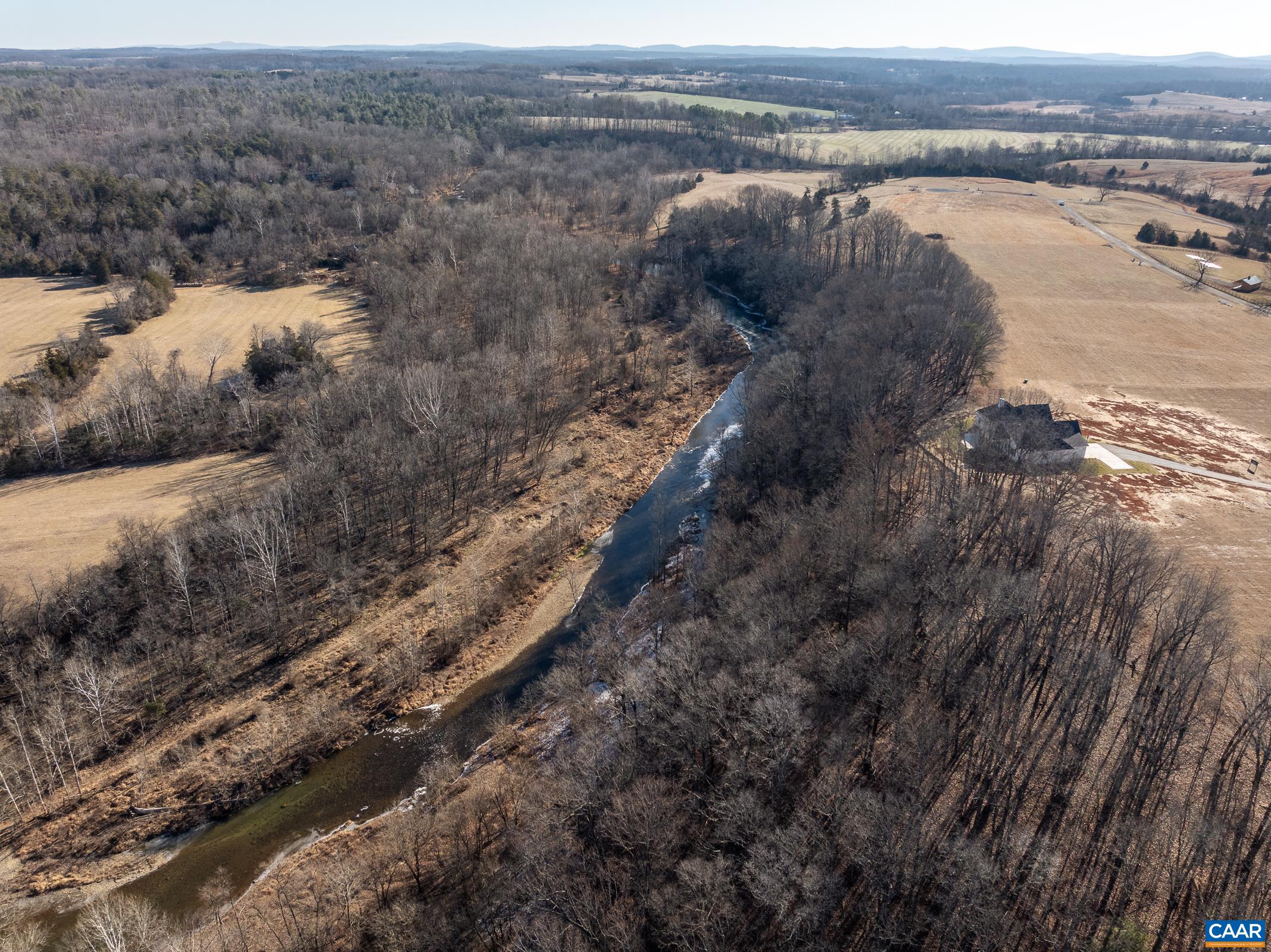 18 Grange Cmns Ridge, Unit 18 Gladstone, VA 24553 - Photo 15 of 17 a view of a lake with beach and mountain view