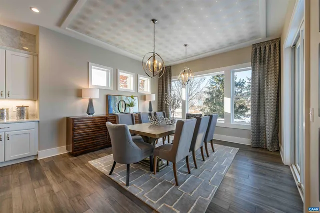a dining room with furniture window wooden floor