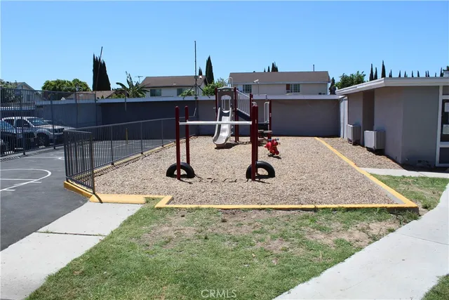 a view of a house with sitting area and garden