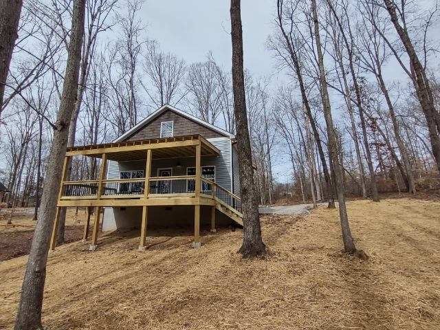 11347 Missionary Ridge Road Bon Aqua, TN 37025 - Photo 2 of 15 a front view of a house with a yard