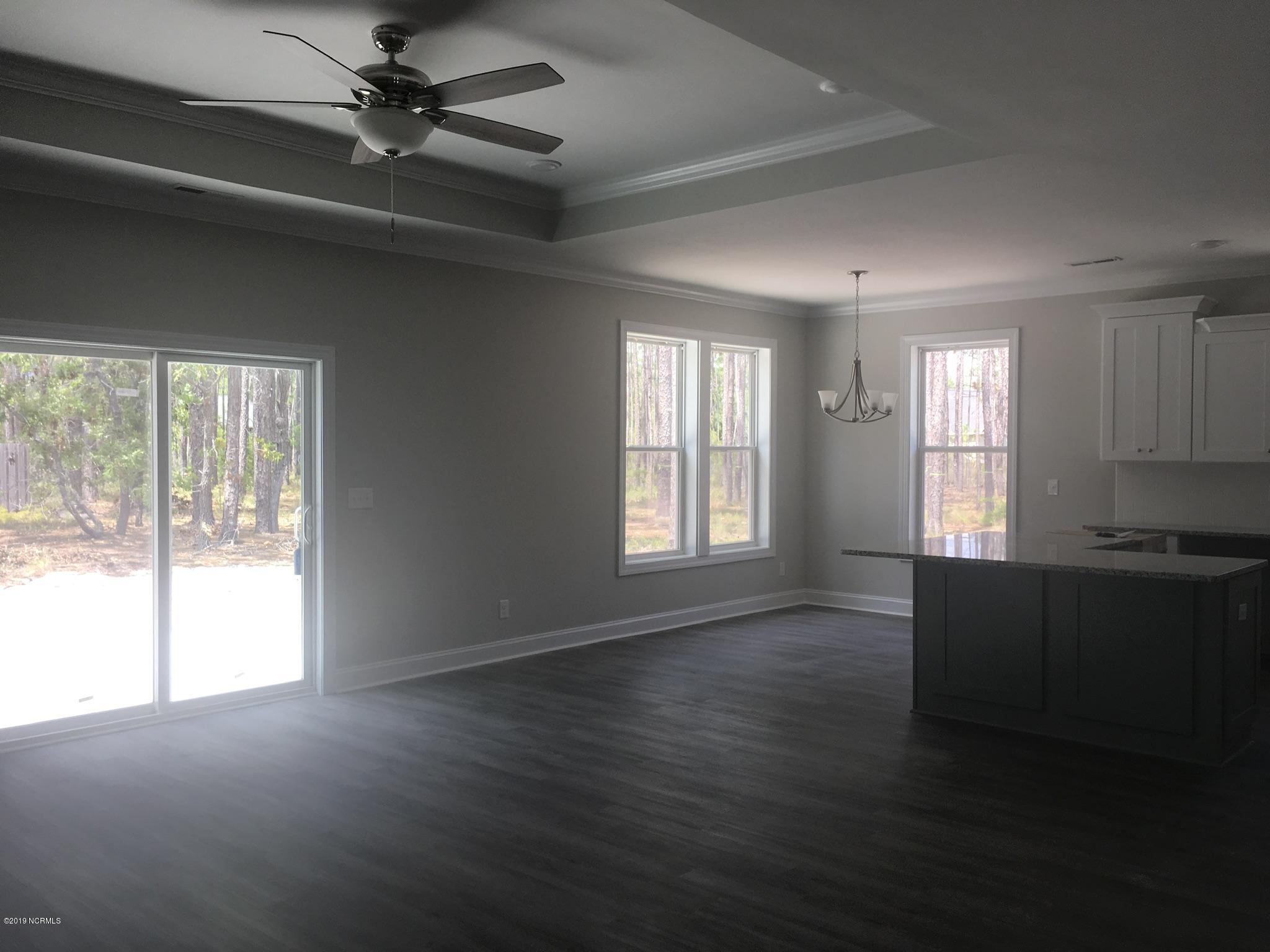 861 Trevino Road Boiling Spring Lakes, NC 28461 - Photo 3 of 12 Open kitchen, dining and great room