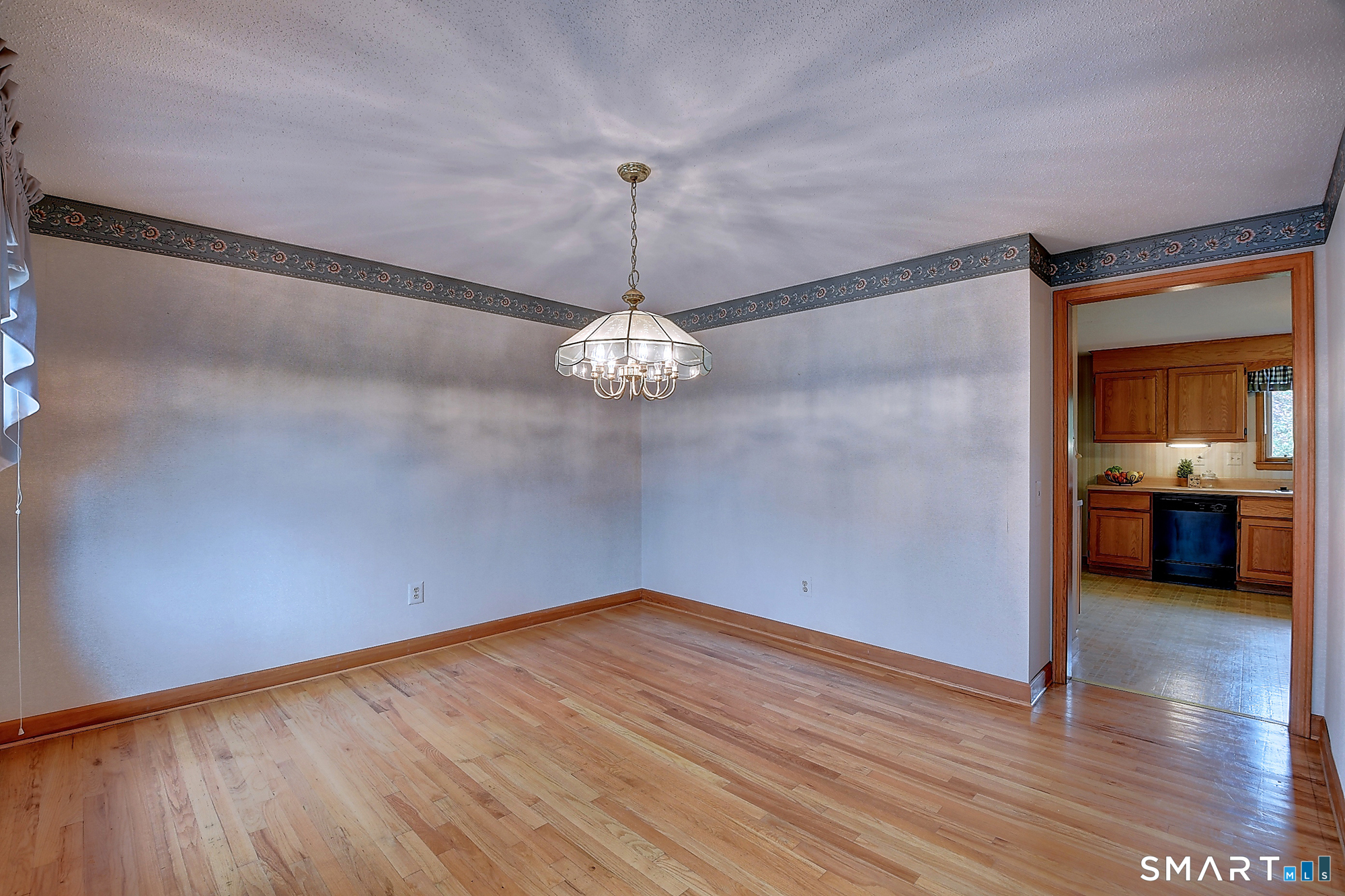 80 Grist Mill Road Wethersfield, CT 06109 - Photo 10 of 40 a view of a room with wooden floor and a ceiling fan