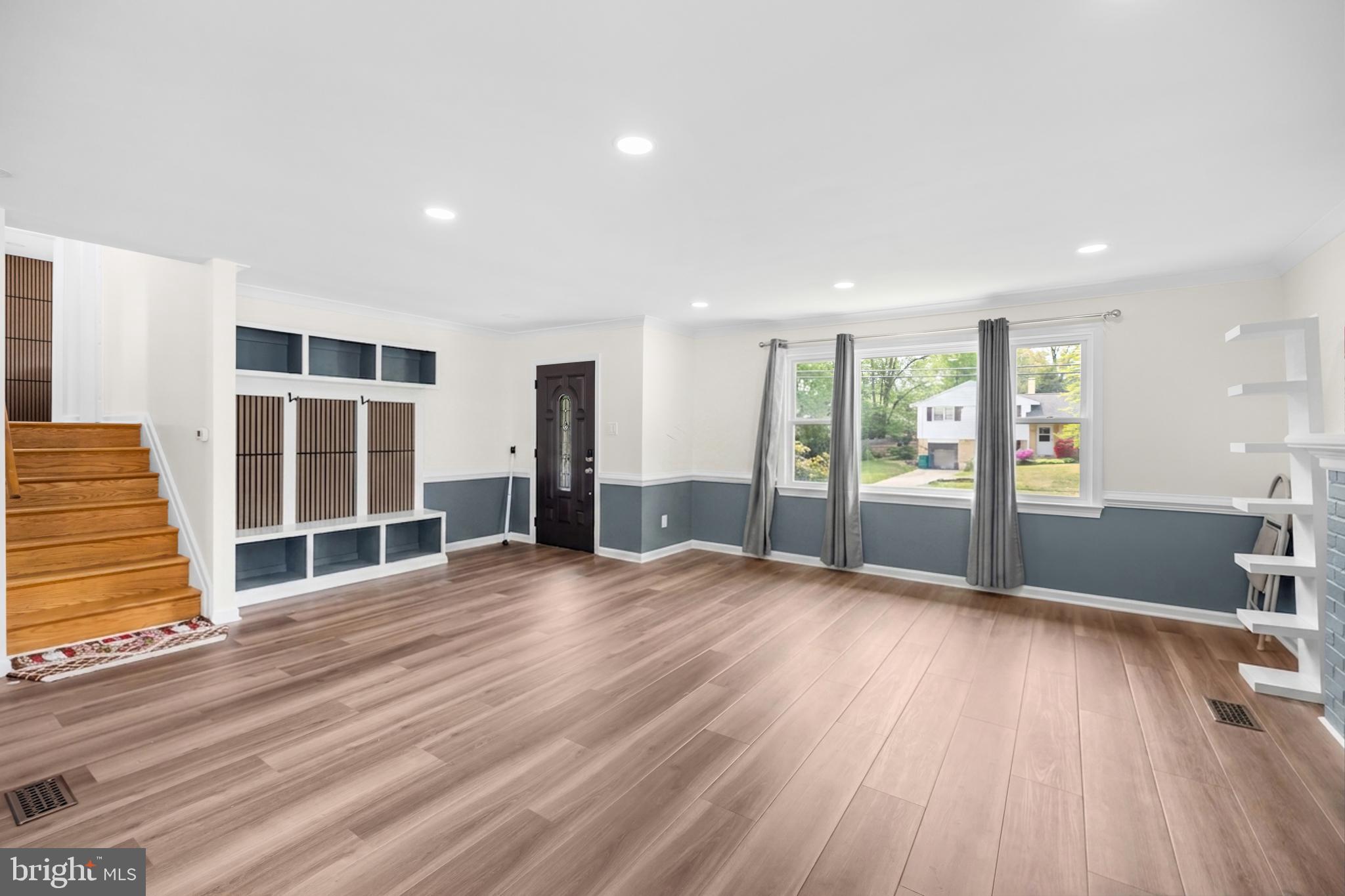 7402 Dunston Street Springfield, VA 22151 - Photo 7 of 37 an empty room with wooden floor and windows