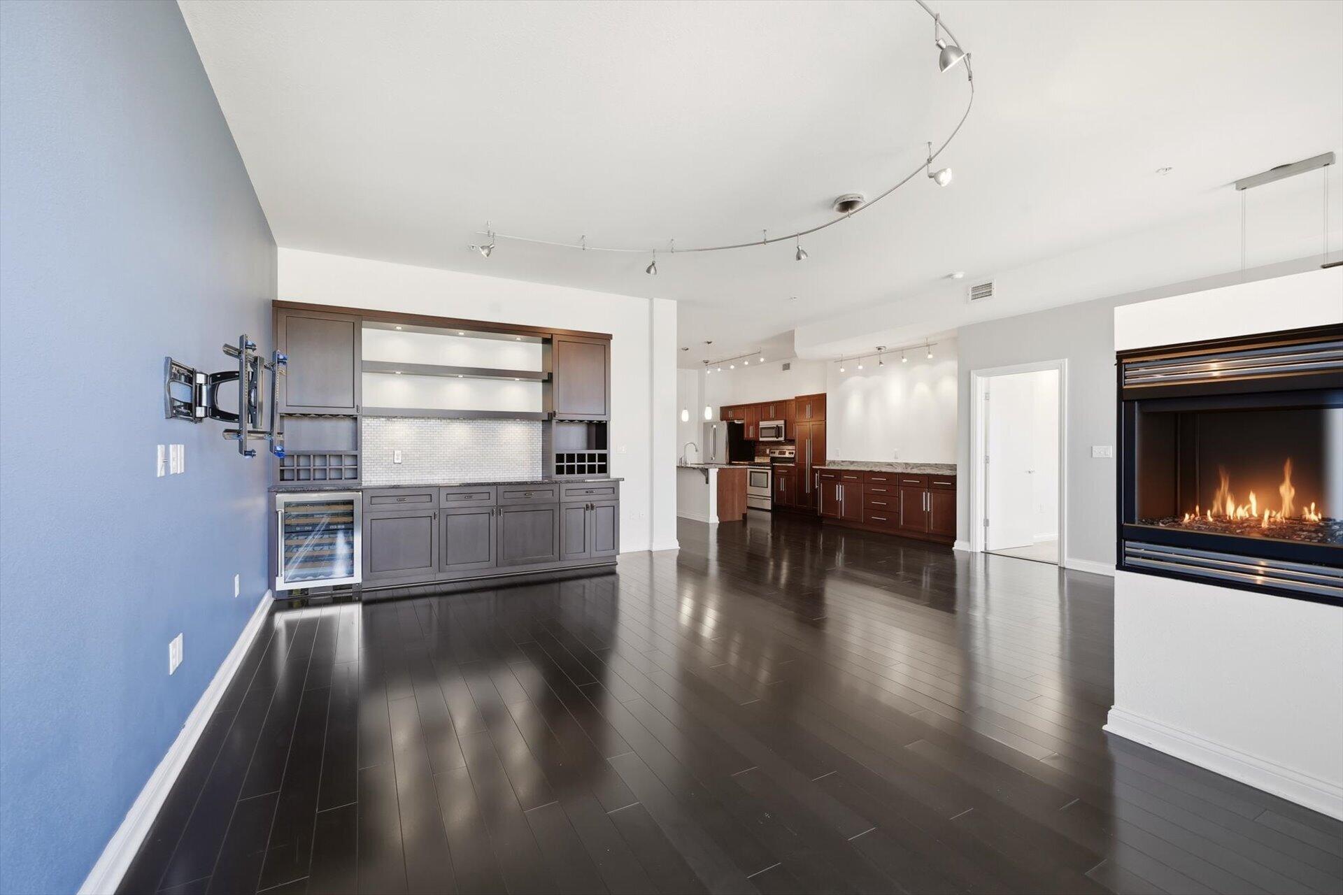 106 West Seeboth Street, Unit 920 Milwaukee, WI 53204 - Photo 9 of 51 Dry bar built in with wine fridge, Gas Fireplace
