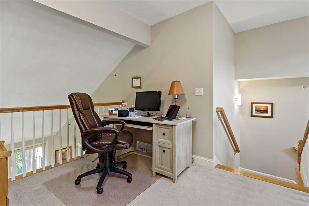 23 Sea Spray Avenue, Unit 563 Mashpee, MA 02649 - Photo 25 of 39 a view of a workspace with furniture and a window