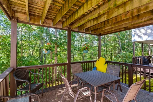 a view of a chair and table in the balcony