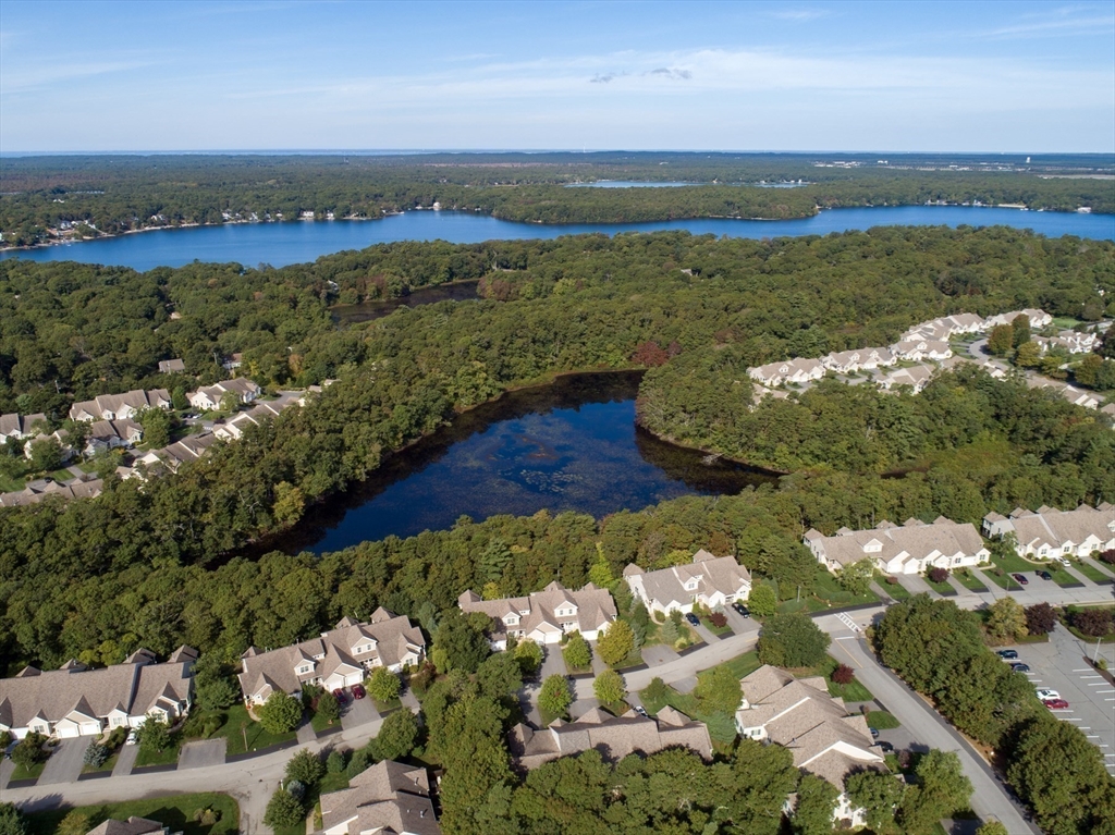 23 Sea Spray Avenue, Unit 563 Mashpee, MA 02649 - Photo 36 of 39 a view of a city with an ocean