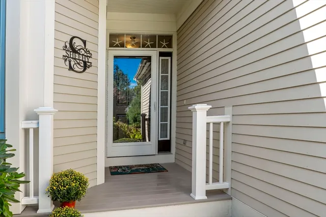 a view of front door and potted plants