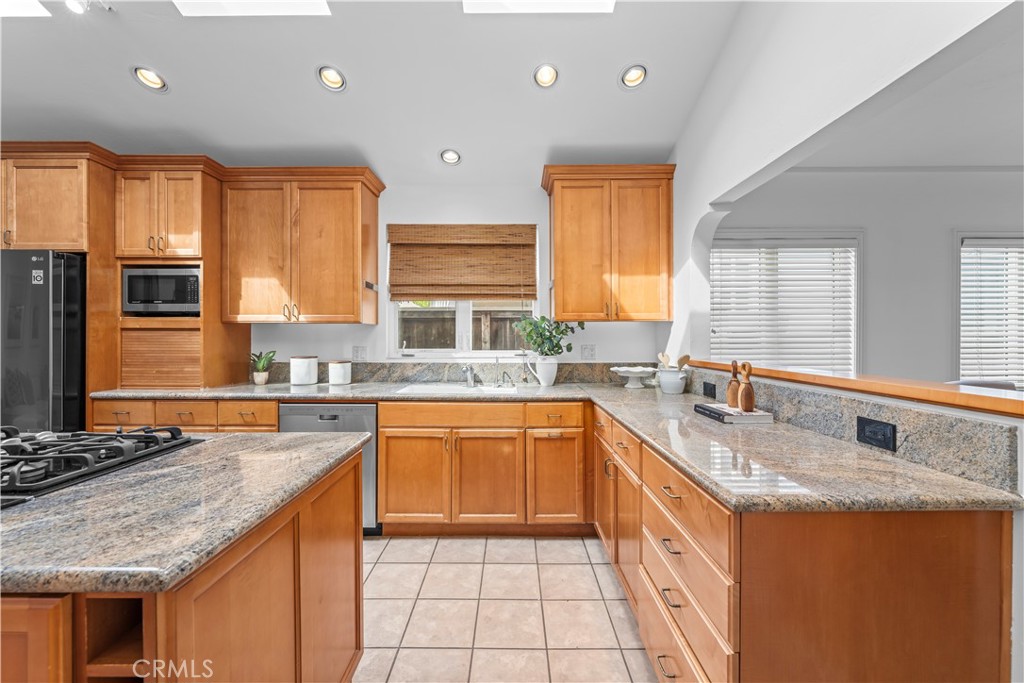 412 5th Street Manhattan Beach, CA 90266 - Photo 14 of 44 a kitchen with stainless steel appliances granite countertop a sink stove and cabinets