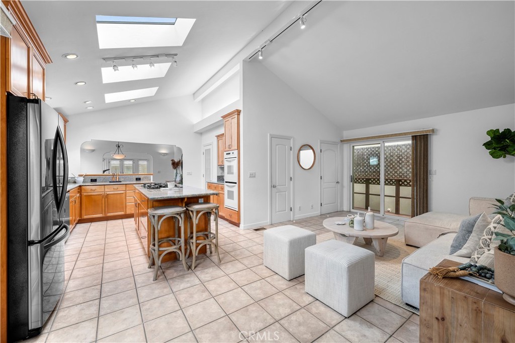 412 5th Street Manhattan Beach, CA 90266 - Photo 17 of 44 a living room with furniture a dining table and chairs