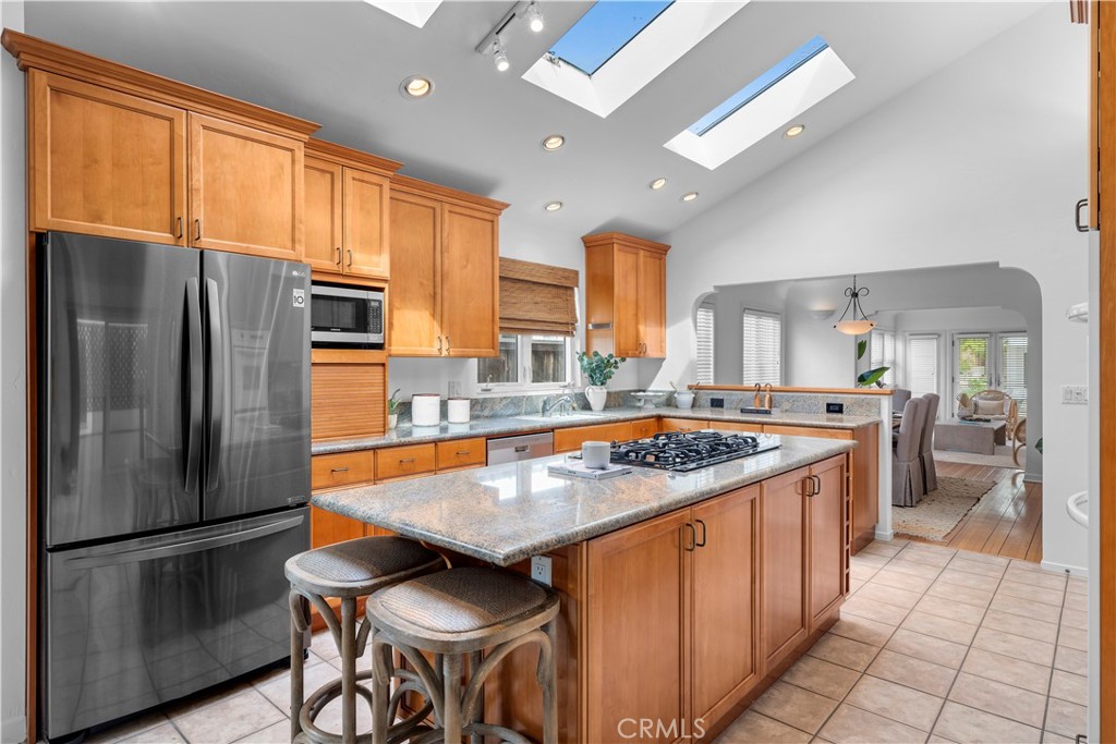 412 5th Street Manhattan Beach, CA 90266 - Photo 19 of 44 a kitchen with stainless steel appliances granite countertop a stove refrigerator sink and cabinets