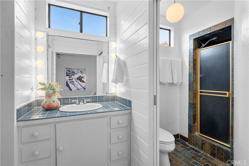 412 5th Street Manhattan Beach, CA 90266 - Photo 26 of 44 a bathroom with a sink a vanity and a shower