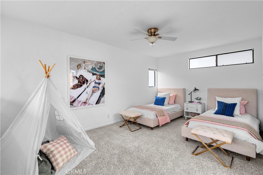 412 5th Street Manhattan Beach, CA 90266 - Photo 28 of 44 a bedroom with furniture and a window