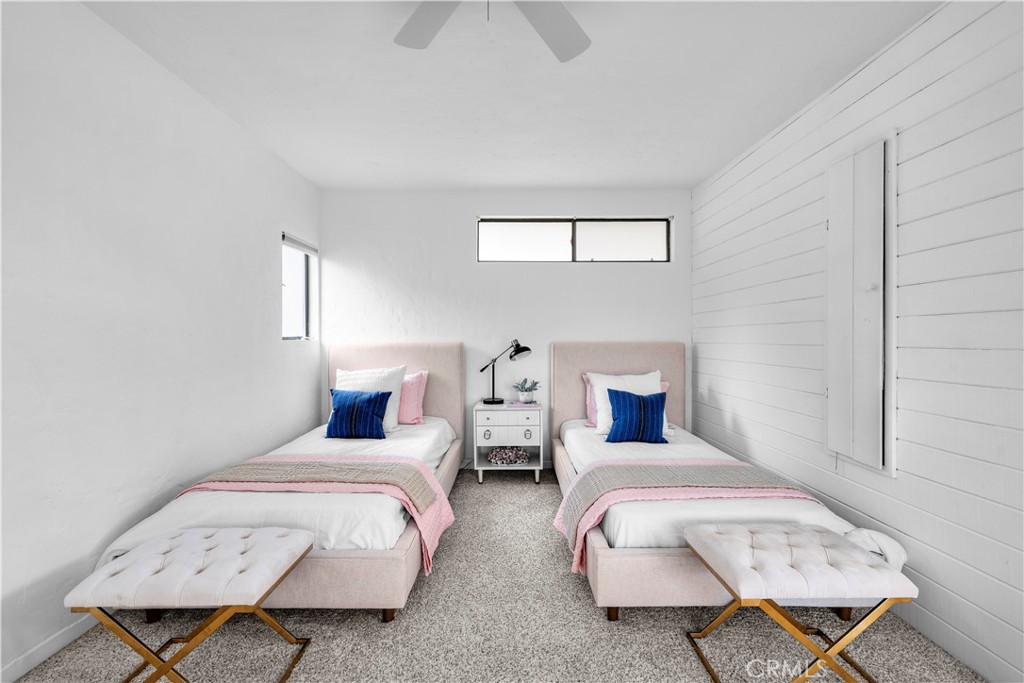 412 5th Street Manhattan Beach, CA 90266 - Photo 29 of 44 a bedroom with two beds and painting on the wall