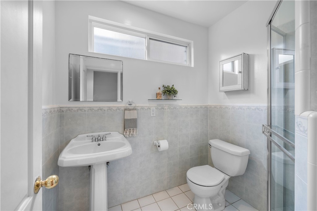 412 5th Street Manhattan Beach, CA 90266 - Photo 33 of 44 a bathroom with a sink toilet and mirror
