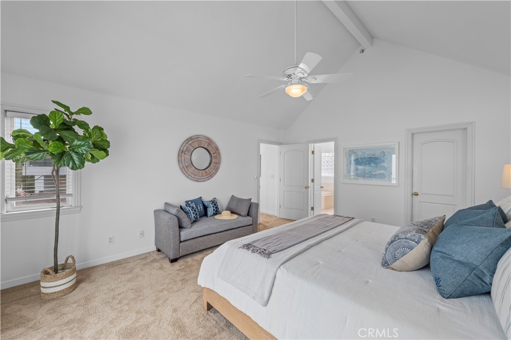 412 5th Street Manhattan Beach, CA 90266 - Photo 40 of 44 a bedroom with a bed and a chandelier