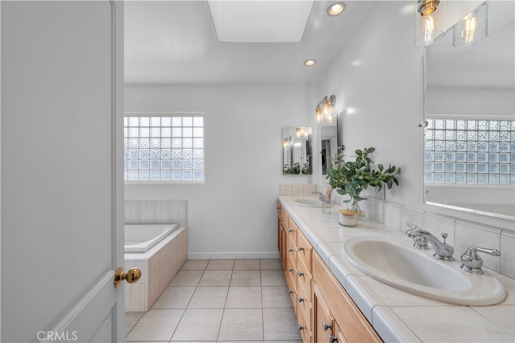 412 5th Street Manhattan Beach, CA 90266 - Photo 42 of 44 a bathroom with a sink and a mirror