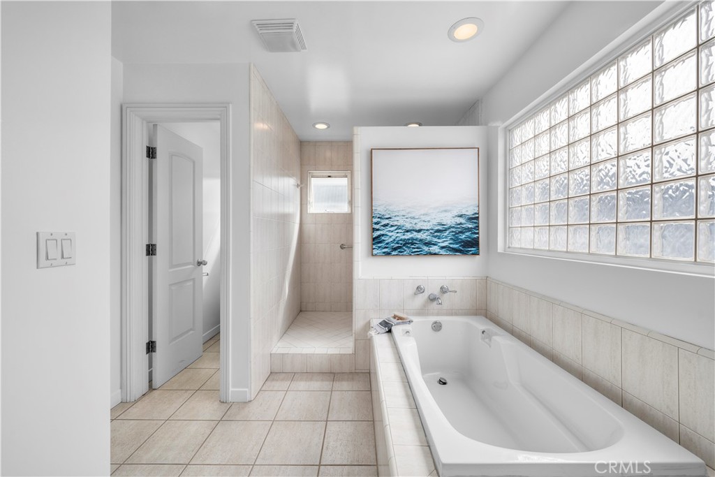 412 5th Street Manhattan Beach, CA 90266 - Photo 43 of 44 a bathroom with a bathtub and a shower