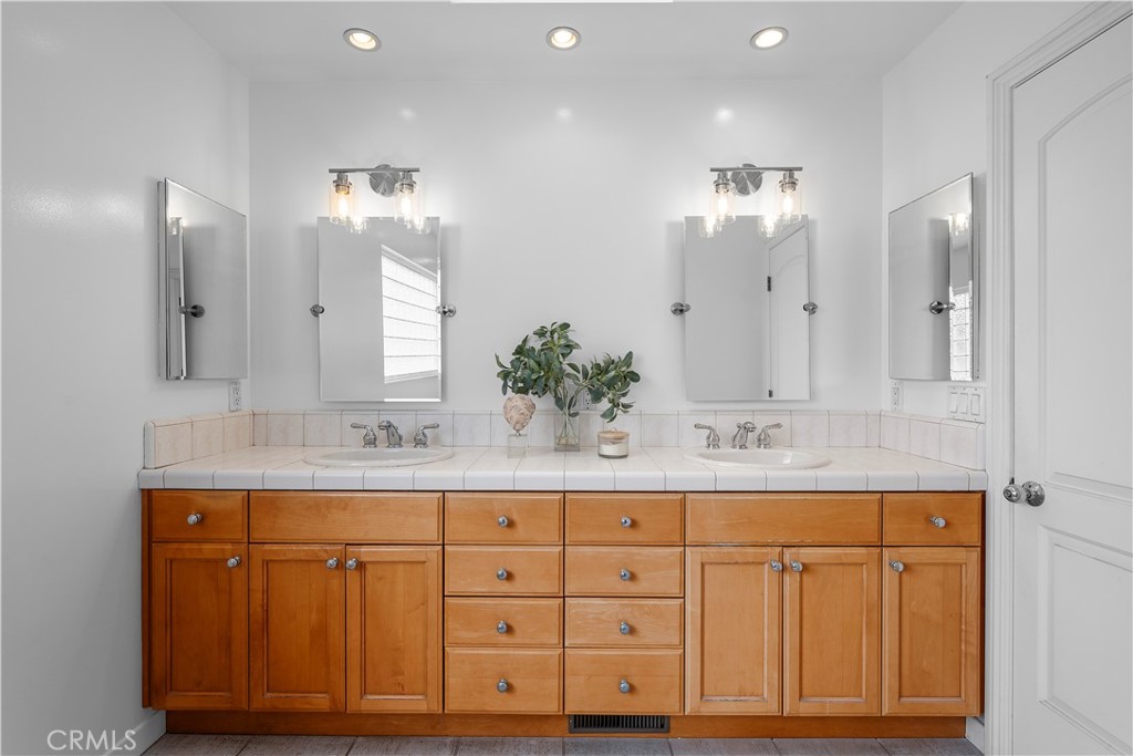 412 5th Street Manhattan Beach, CA 90266 - Photo 44 of 44 a bathroom with a double vanity sink mirror and