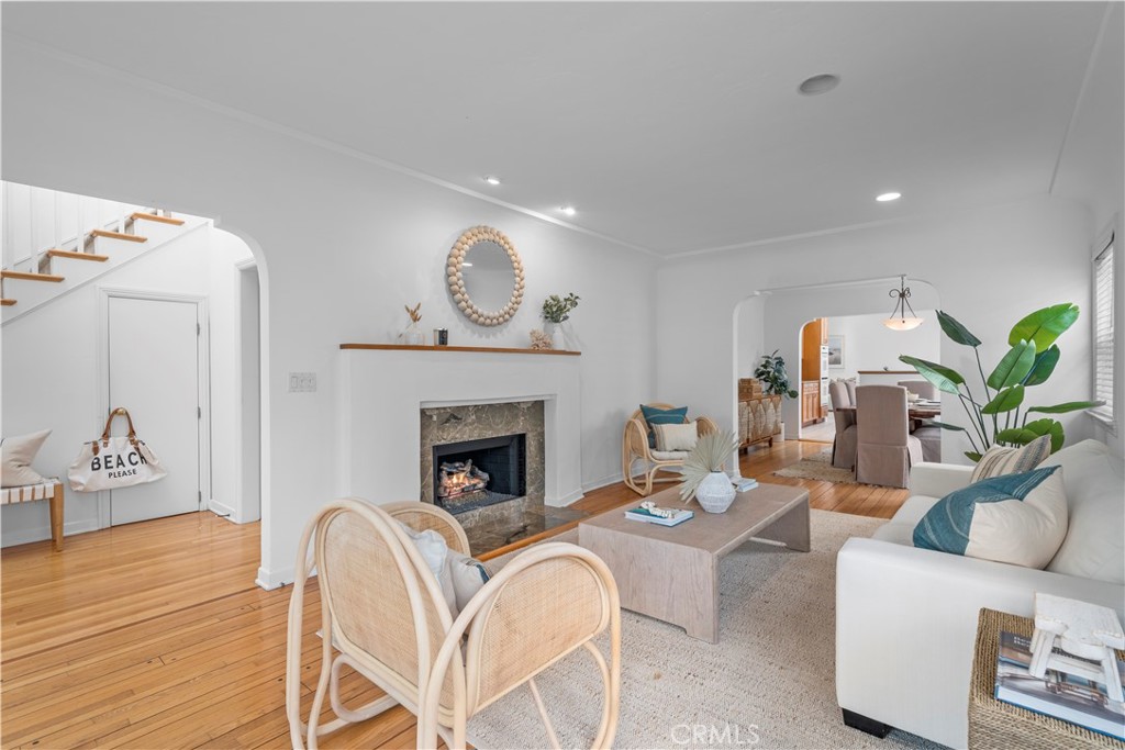 412 5th Street Manhattan Beach, CA 90266 - Photo 8 of 44 a living room with furniture a fireplace and wooden floor
