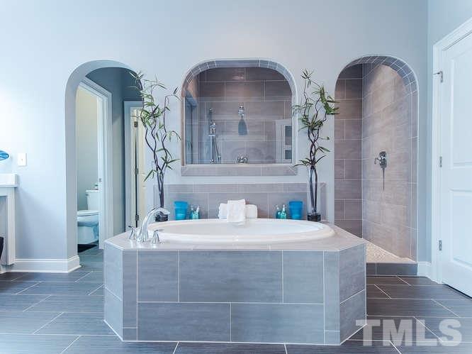 3619 Rolston Drive Raleigh, NC 27609 - Photo 12 of 24 A stunning private retreat with Oversized separate shower and Shower seat, semi-frameless door , 5 ' drop in tub with tile surround, double vanities with granite countertops, Linen closet and a huge walk in closet. It's a refreshing space!!