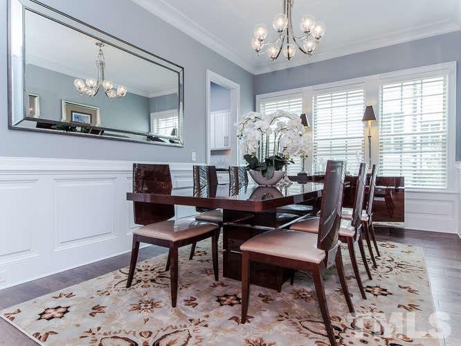3619 Rolston Drive Raleigh, NC 27609 - Photo 5 of 24 The grand size dining room is centered by its large crown molding and balanced by raised panel wainscoting with chair rail. A wonderful room for to enjoy with family or friends for dinner.