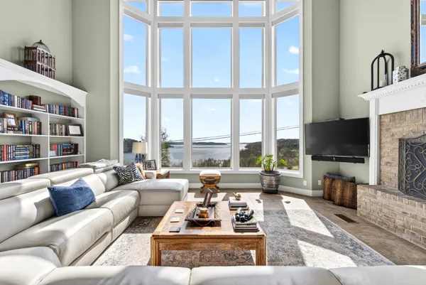 a living room with granite countertop furniture and a flat screen tv