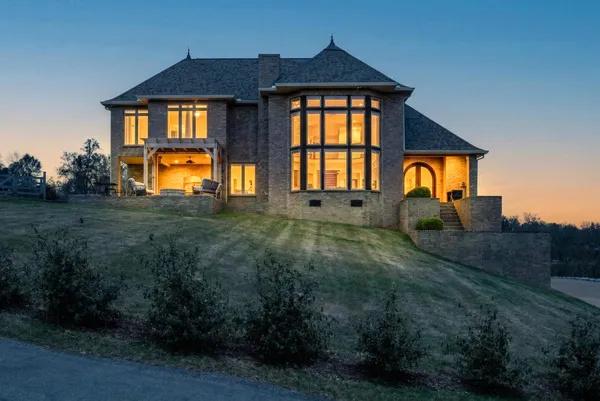 a front view of a house with a yard