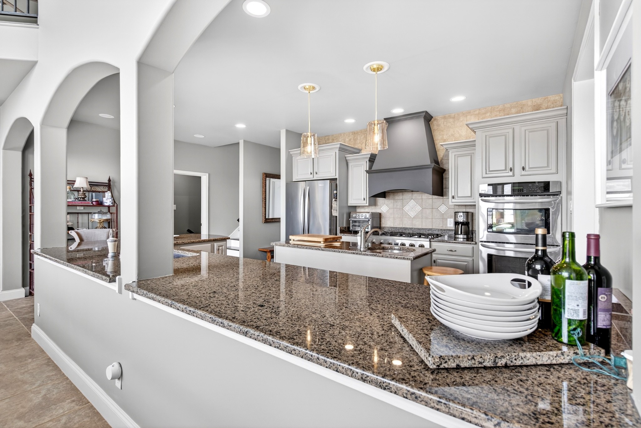 501 River Trace Road Dover, TN 37058 - Photo 32 of 84 a large kitchen with stainless steel appliances granite countertop a sink a stove and a wooden floors