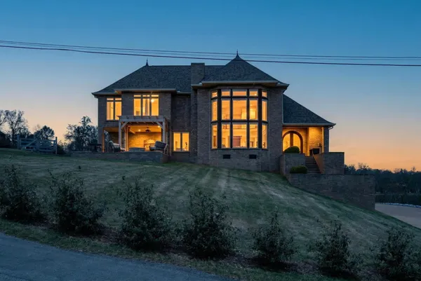 a front view of a house with a yard