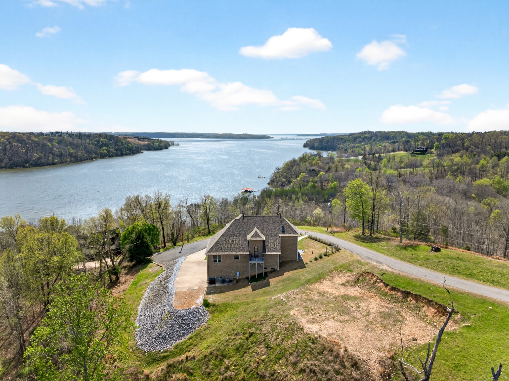 501 River Trace Road Dover, TN 37058 - Photo 73 of 84 an aerial view of a house with a yard and lake view