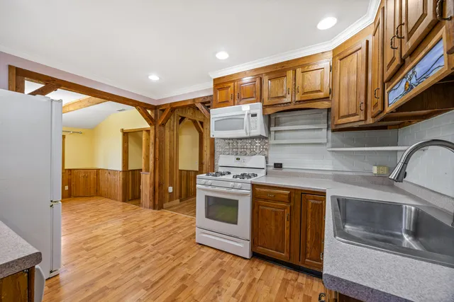 a kitchen with a sink cabinets and stainless steel appliances