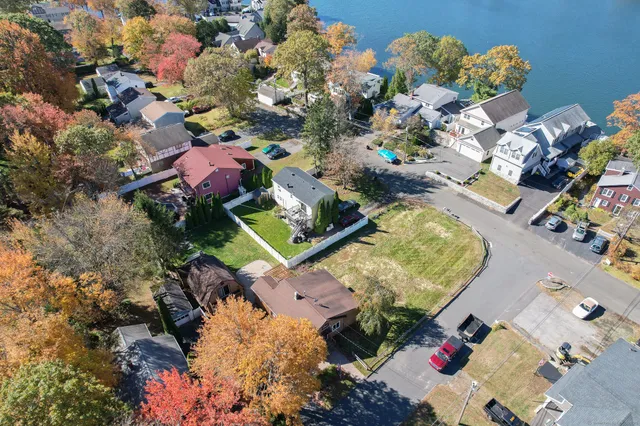 an aerial view of residential house with yard