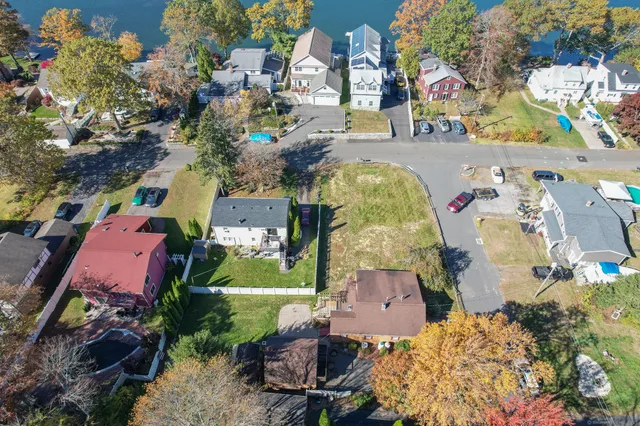 an aerial view of a houses with outdoor space