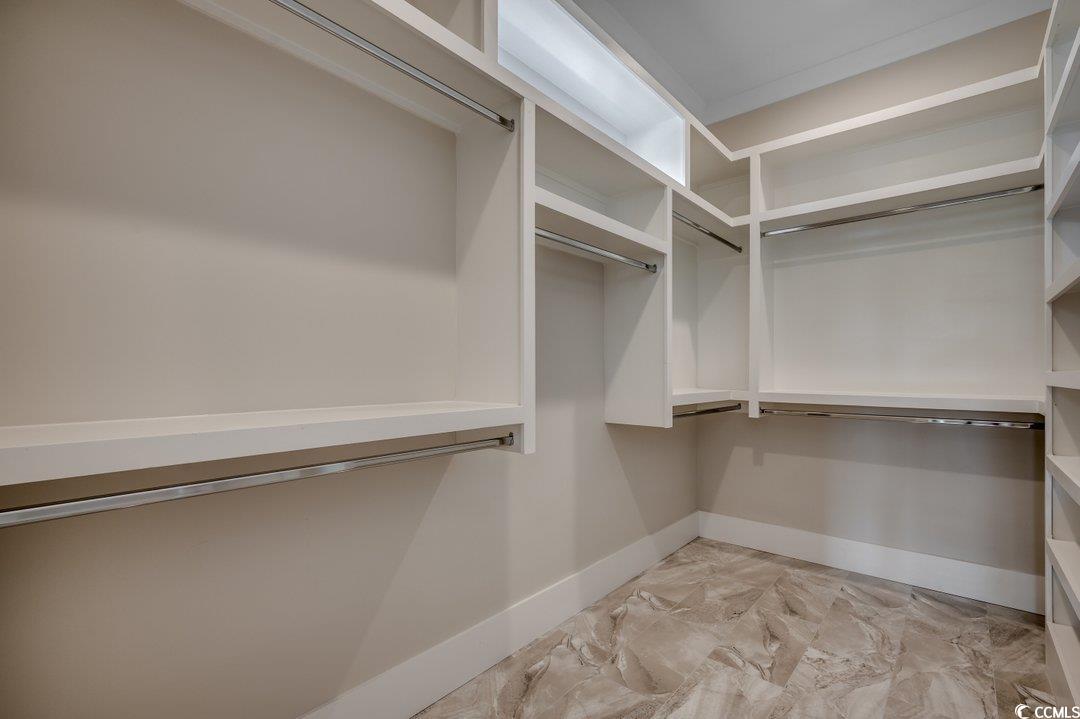 404 Plantation Oaks Drive Myrtle Beach, SC 29579 - Photo 12 of 29 Walk in closet featuring light marble finish flooring