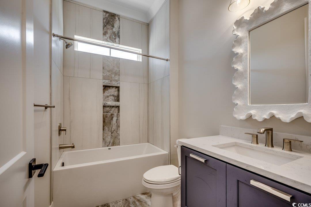 404 Plantation Oaks Drive Myrtle Beach, SC 29579 - Photo 15 of 29 Full bath featuring vanity, toilet, and washtub / shower combination