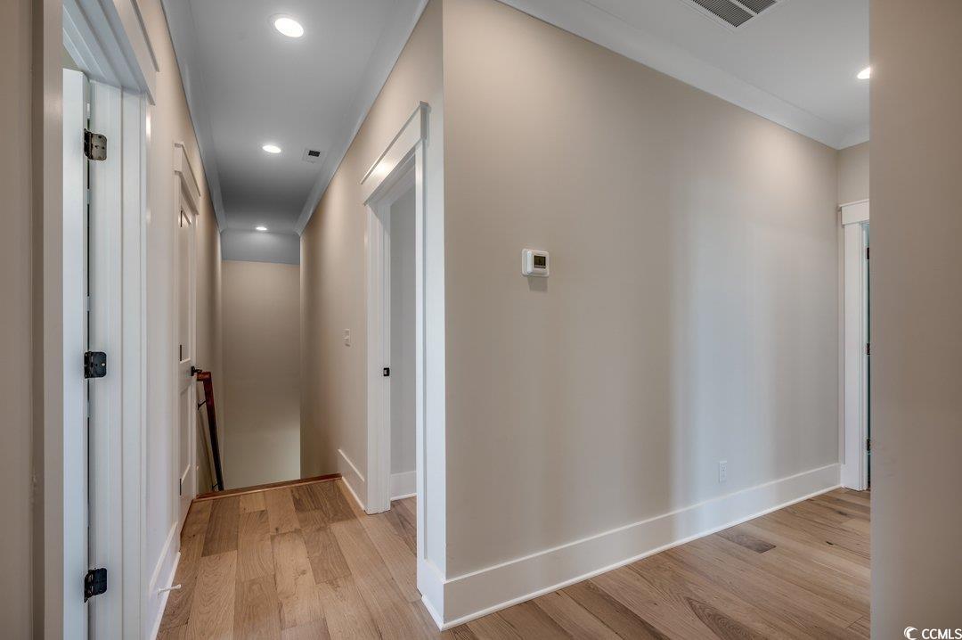404 Plantation Oaks Drive Myrtle Beach, SC 29579 - Photo 17 of 29 Corridor with light wood-style flooring, baseboards, and recessed lighting
