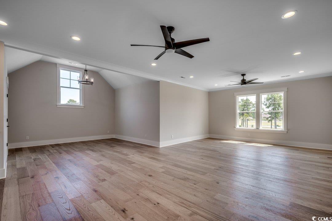 404 Plantation Oaks Drive Myrtle Beach, SC 29579 - Photo 18 of 29 Bonus room with healthy amount of natural light, a ceiling fan, light wood-type flooring, baseboards, and recessed lighting