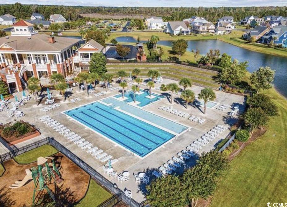 404 Plantation Oaks Drive Myrtle Beach, SC 29579 - Photo 24 of 29 Community pool featuring a water view and a residential view
