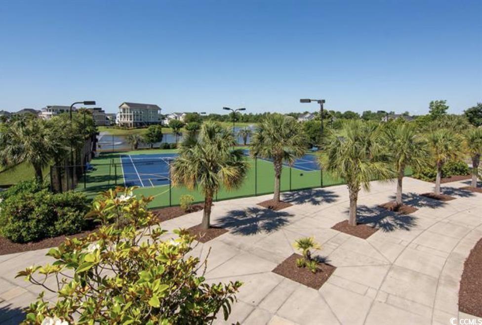 404 Plantation Oaks Drive Myrtle Beach, SC 29579 - Photo 25 of 29 View of home's community featuring a tennis court and fence