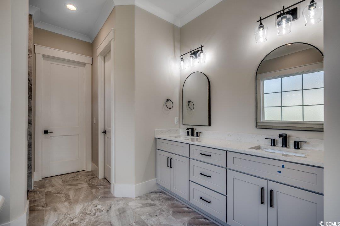 404 Plantation Oaks Drive Myrtle Beach, SC 29579 - Photo 9 of 29 Full bathroom with ornamental molding, marble finish floors, baseboards, double vanity, and recessed lighting